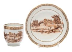 A Chinese export cup and saucer: painted in sepia monochrome with a European river landscape with a