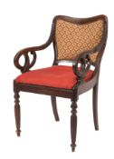 An early Victorian Colonial carved hardwood open armchair:,