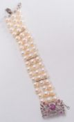 A cultured pearl three-strand bracelet: with 51 cultured pearls each approximately 7mm diameter,