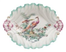 A Chelsea oval dish: of silver form with shaped foliate rim highlighted in green, puce and gilt,