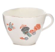 A Chantilly peach-shaped cup: with loop handle,