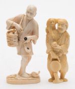 A Japanese carved ivory okimono of a fisherman: carrying his catch in a basket,