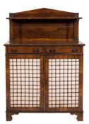 A late Regency rosewood chiffonier:, of small size, with reel turned mouldings,