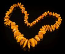 An amber fragment bead, single-string necklace: approximately 80cm total length,