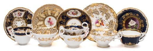 A Samuel Alcock trio and four cups and saucers: the trio decorated with flowers on a blue and gilt