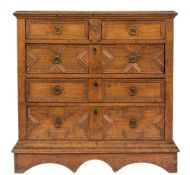 A 17th Century oak rectangular chest on a plinth stand:, the top with a moulded edge,