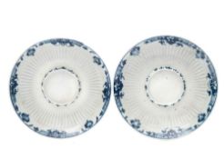 Two First Period Worcester blue and white trembleuse saucers: in the Saint Cloud manner,