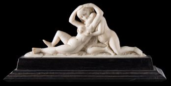 A late 19th/early 20th century carved ivory group: of two lovers embracing,