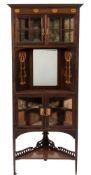 An Art Nouveau mahogany and inlaid standing corner display cabinet:,