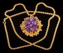 An amethyst matrix crystal and diamond-set pendant: the central,