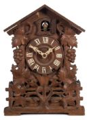 An oak Black Forest cuckoo clock: the eight-day duration,