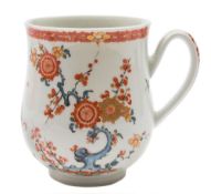 A First Period Worcester mug: of bell shape with ridged loop handle,