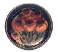 A Moorcroft Tudric pewter mounted bowl: tubelined in the Poppies pattern in red,