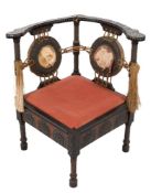 A Carlo Bugatti ebonised, walnut inlaid and brass and pewter mounted corner chair:,
