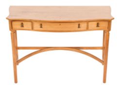 Edward Barnsley A 1960's walnut side table inlaid with sycamore lines:, of serpentine outline,