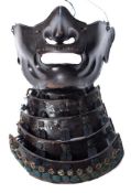 A Meiji Japanese period black-lacquered iron part suit of Samurai armour: the eight panel bowl to
