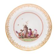 A Meissen saucer: finely painted with a chinoiserie scene in the manner of J.G.