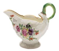 A First Period Worcester dolphin ewer creamboat: with green lamprey handle,