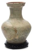A large Chinese pottery baluster jar: the exterior covered in a mottled pale green glaze and