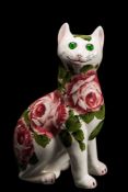 A Wemyss Ware pottery cat: modelled in seated posture and decorated with pink cabbage roses,