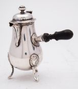 A French silver cafe au lait pot and cover: with hinged domed cover and urn finial,