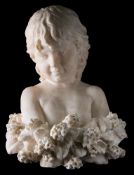 A 19th century carved white marble bust of a child: surrounded by a floral garland.