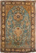 A Qum rug:, the powder blue mihrab with a design of cartouche medallions, birds,