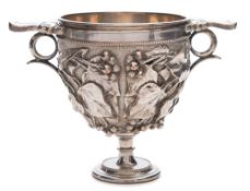 An Elkington plated two handled pedestal goblet: with embossed vine leaf and grape decoration,