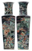 An opposing pair of Chinese porcelain famille noire vases: of shouldered square section with raised