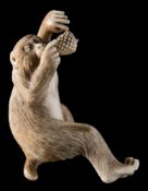 A Japanese carved ivory okimono: modelled as a howler monkey with pine cones, unsigned,