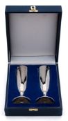 A pair of silver champagne flutes, maker J A Campbell, London, 2000:,