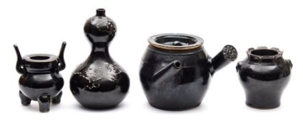 A group of Chinese brown glazed wares: comprising a Ding form censer a baluster vase with mask