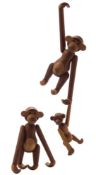 * Kay Bojesen (1886-1958) three limba wood and teak articulated Monkey figures:,