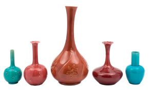 Five Burmantofts faience art pottery vases: of slender form,