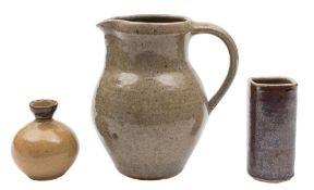 Three pieces of Lowerdown Pottery stoneware: comprising a jug under oatmeal glazes,