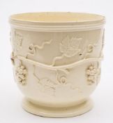 An early 19th Century Continental creamware wine cooler:, applied with encircling fruiting vines,
