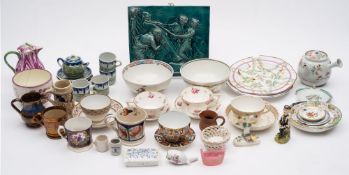 A mixed lot of ceramics: including a green glazed relief moulded tile,
