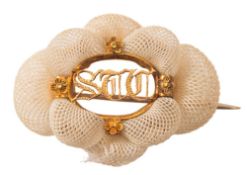 An early 19th Century gold and hair plait brooch initialled 'S.T.C.:, 4cm. wide.