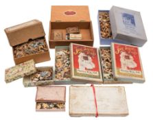 A group of seven woodbacked jigsaws: (some defective) and three safety match boxes,