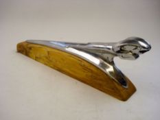 A 1940/50s Dodge chrome plated Ram car mascot:, on later wooden base 41cm long.