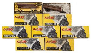 Kadee a collection of six various log cars together with a logging caboose:, boxed.