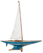 A radio control model pond yacht:, with simulated planked decks,