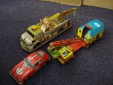 A Biller tinplate clockwork lorry mounted crane:, in red blue and yellow with bucket grab,