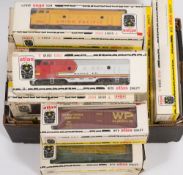 A collection of Atlas O gauge locomotives and rolling stock:,