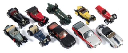 A group of 1/43rd scale white metal cars:, including a Tin Wizard No 103 Porsche 924 Carrera GT.