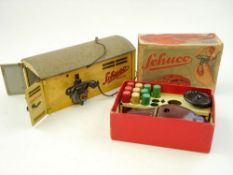 A Schuco No 3000 Telesteering car:, in maroon with control wire and wooden pegs,
