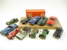 A group of various white metal cars:, including a Connaught B type,
