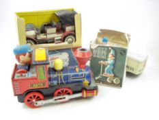 A Schuco Old Timer Mercedes Simplex 1902:, together with a Japanese tinplate battery locomotive,