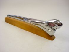 A 1949/50 Dodge chrome plated Ram car mascot:, on later wooden base 41cm long.