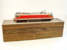A Fulgurex two rail electric Class CS-21001 Overhead Electric locomotive:, in SNCF red , orange,